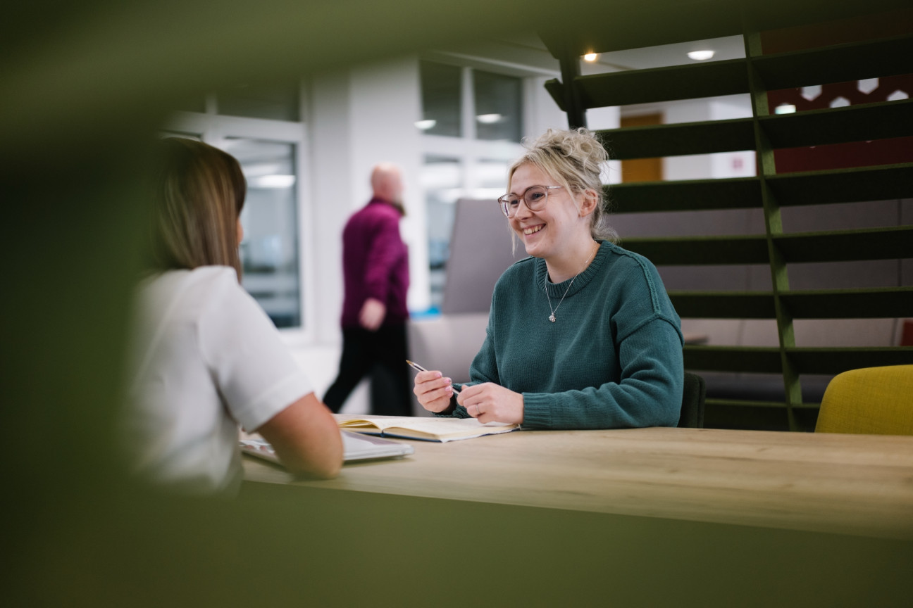 Colleague smiling in shared working space