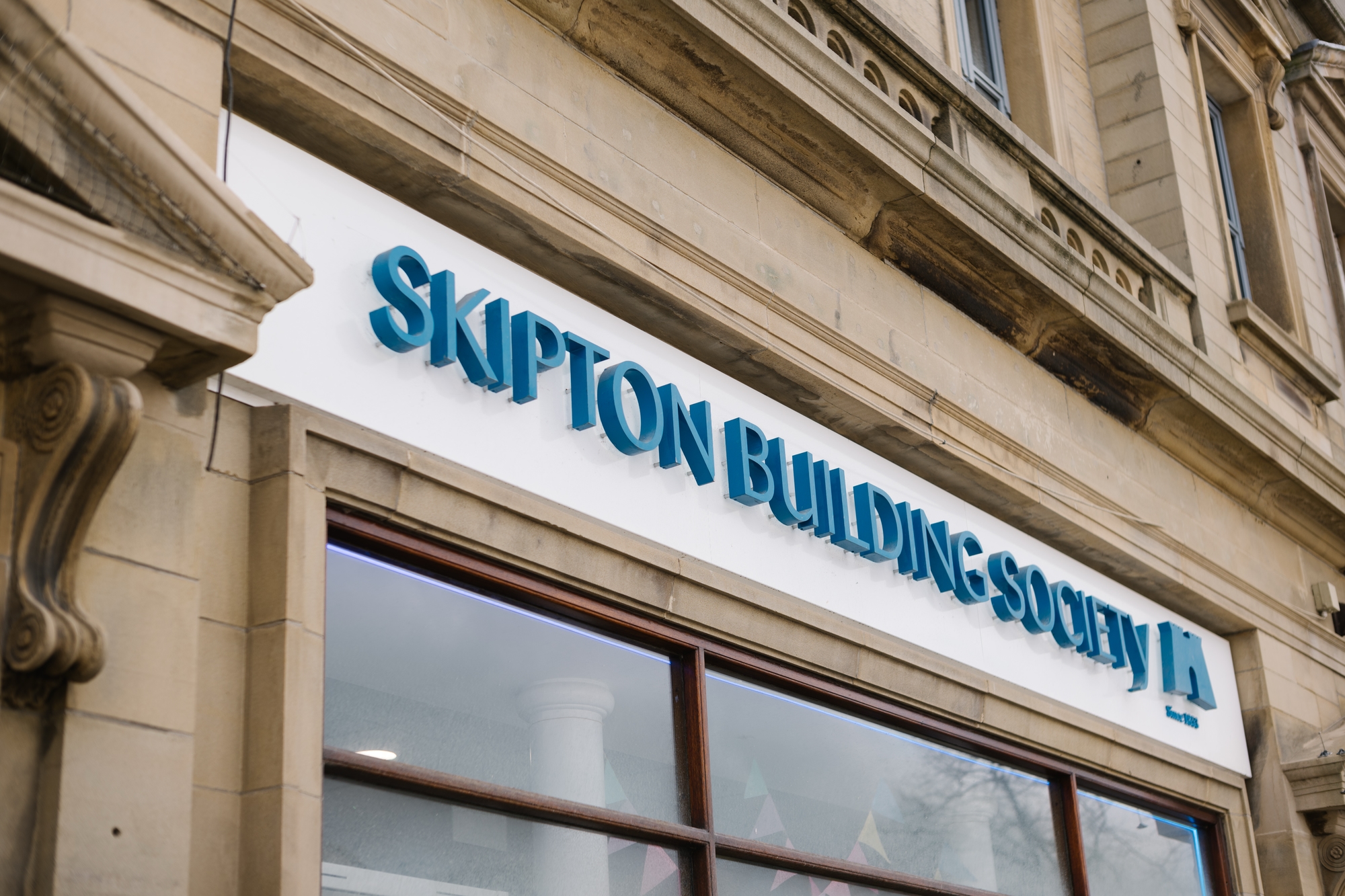 External signage of Skipton branch saying 'Skipton Building Society'.
