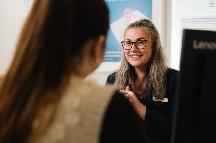Branch colleague serving customer in Skipton branch.